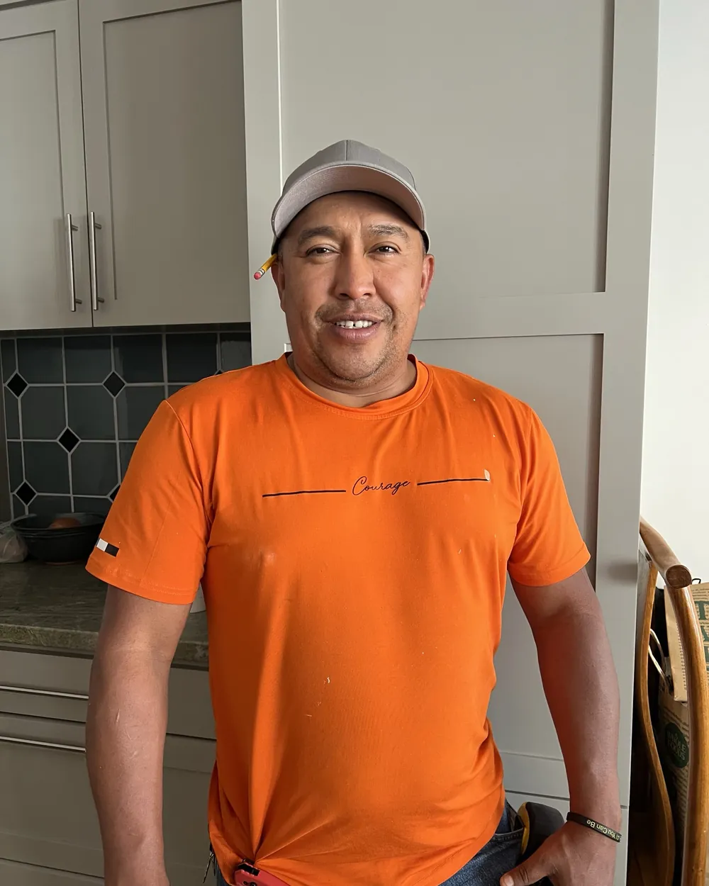 Carlos of Peninsula Handyman standing in a client's kitchen